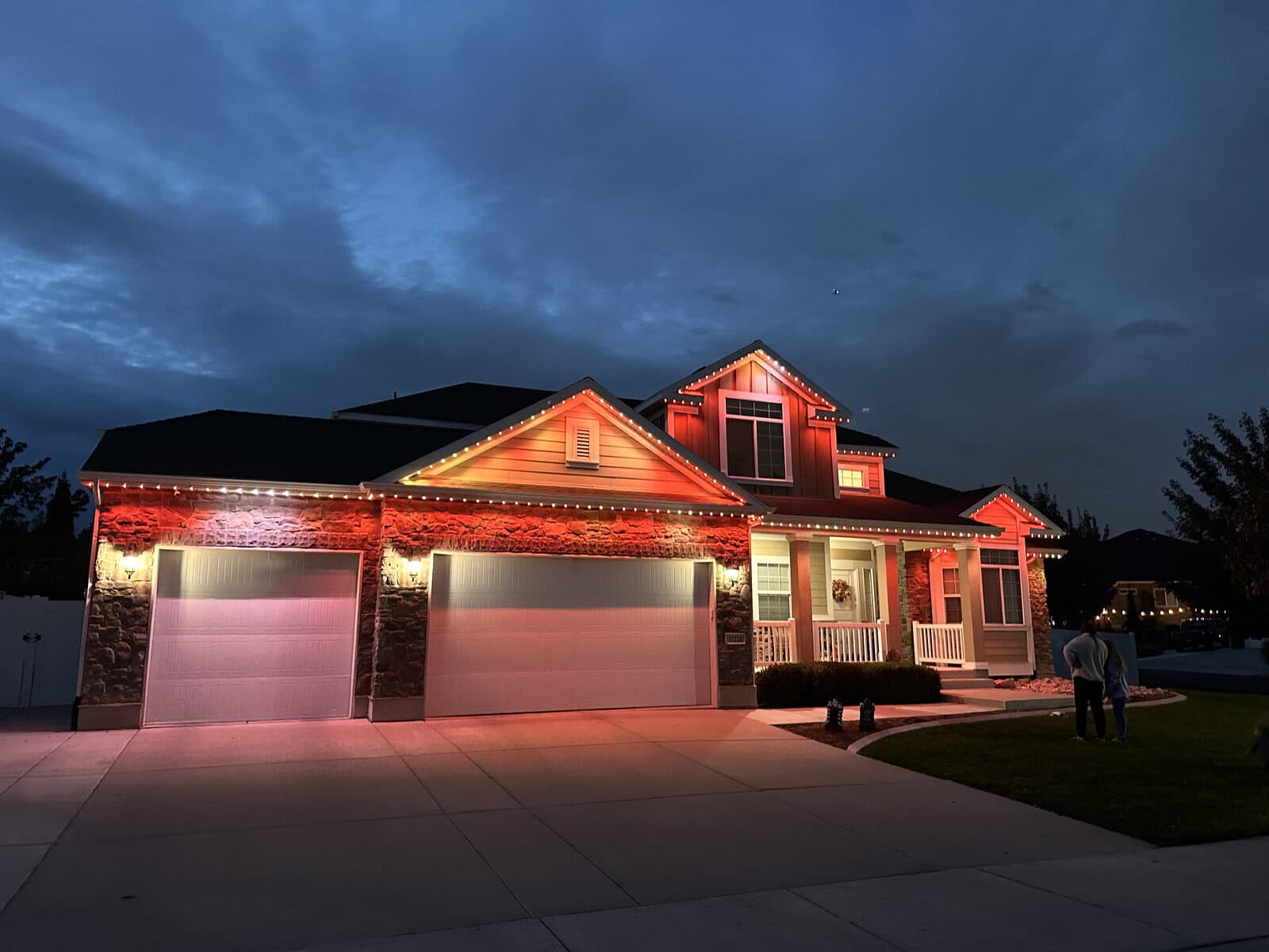 Real Alta permanent install alternating red and warm white at dusk